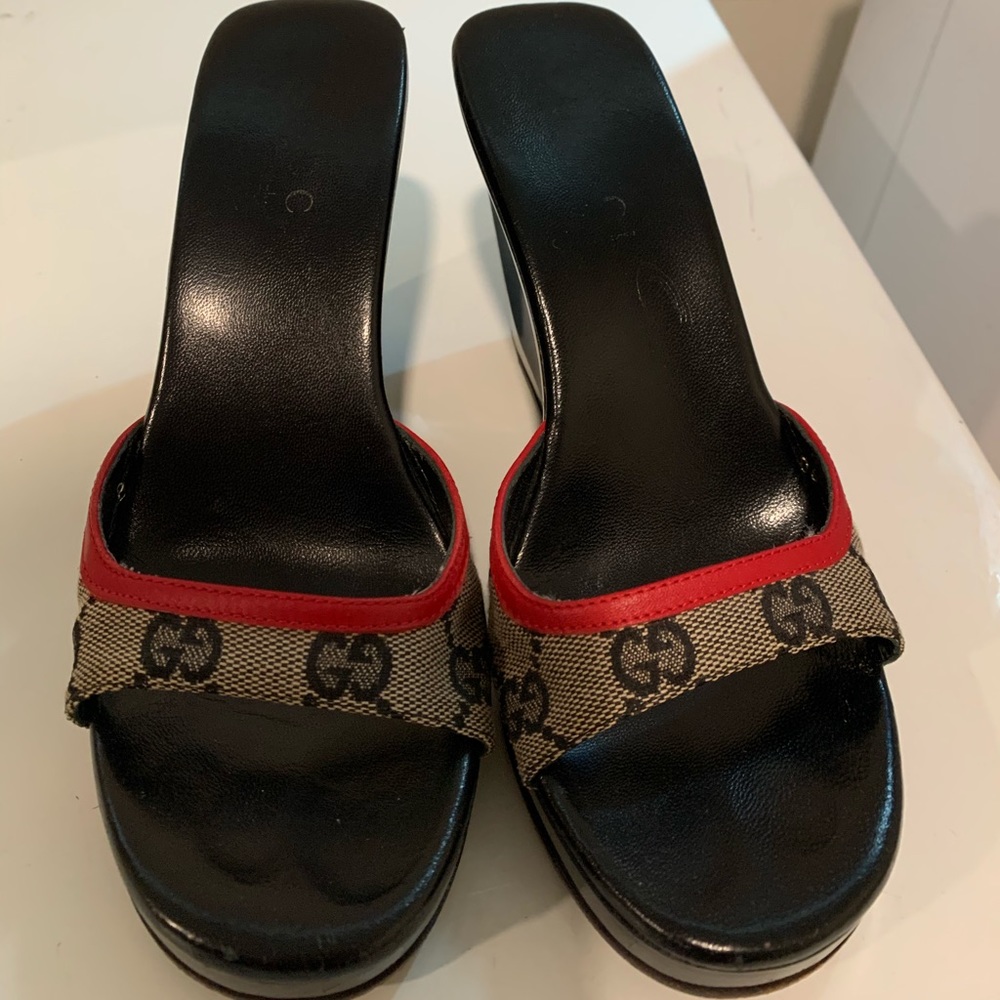 I’m selling these Gucci wedge shoes Size 5 .